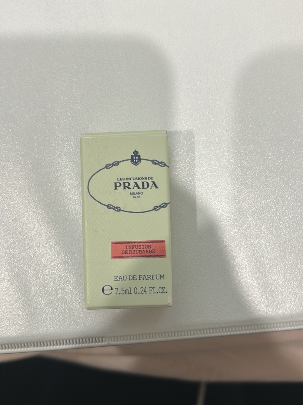 Prada pale mint green box with coral-pink label